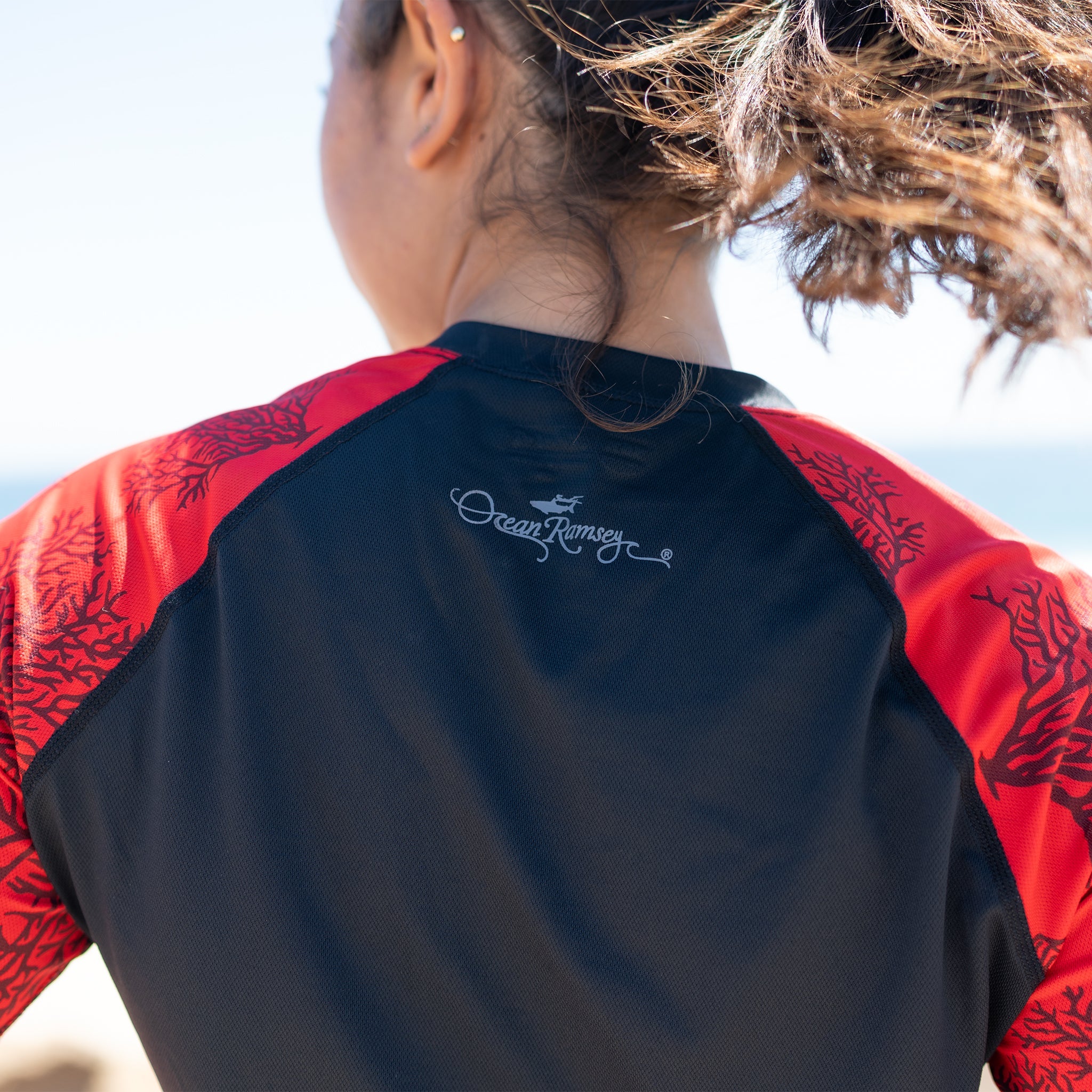 Sally Cohen in the red coral ventX long sleeve top
