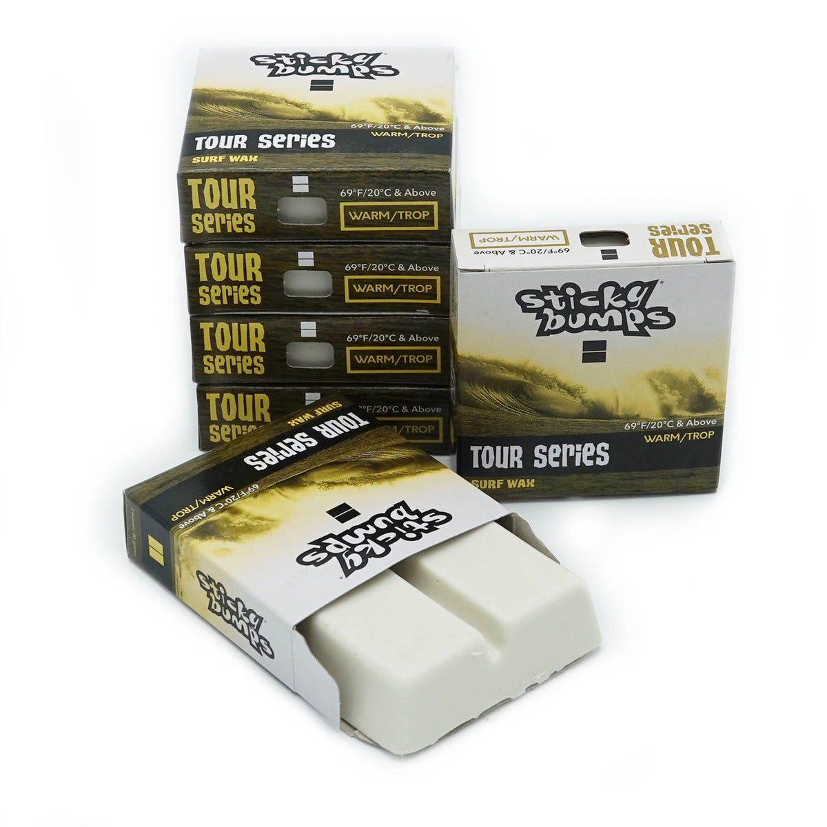 Stack of Sticky Bumps Tour Series Warm/Tropical surfboard wax bars with cream-colored wax visible.