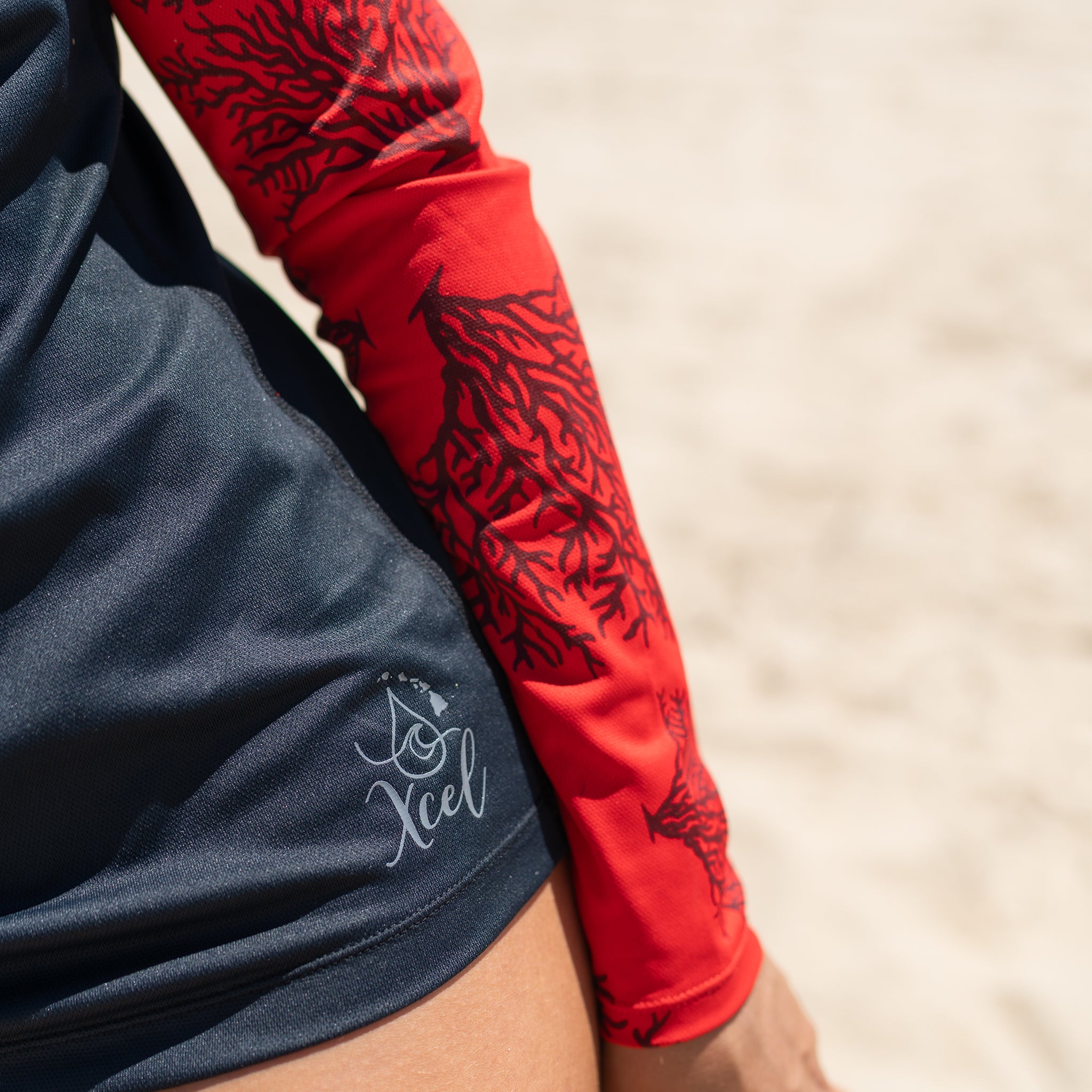 Sally Cohen in the red coral ventX long sleeve top