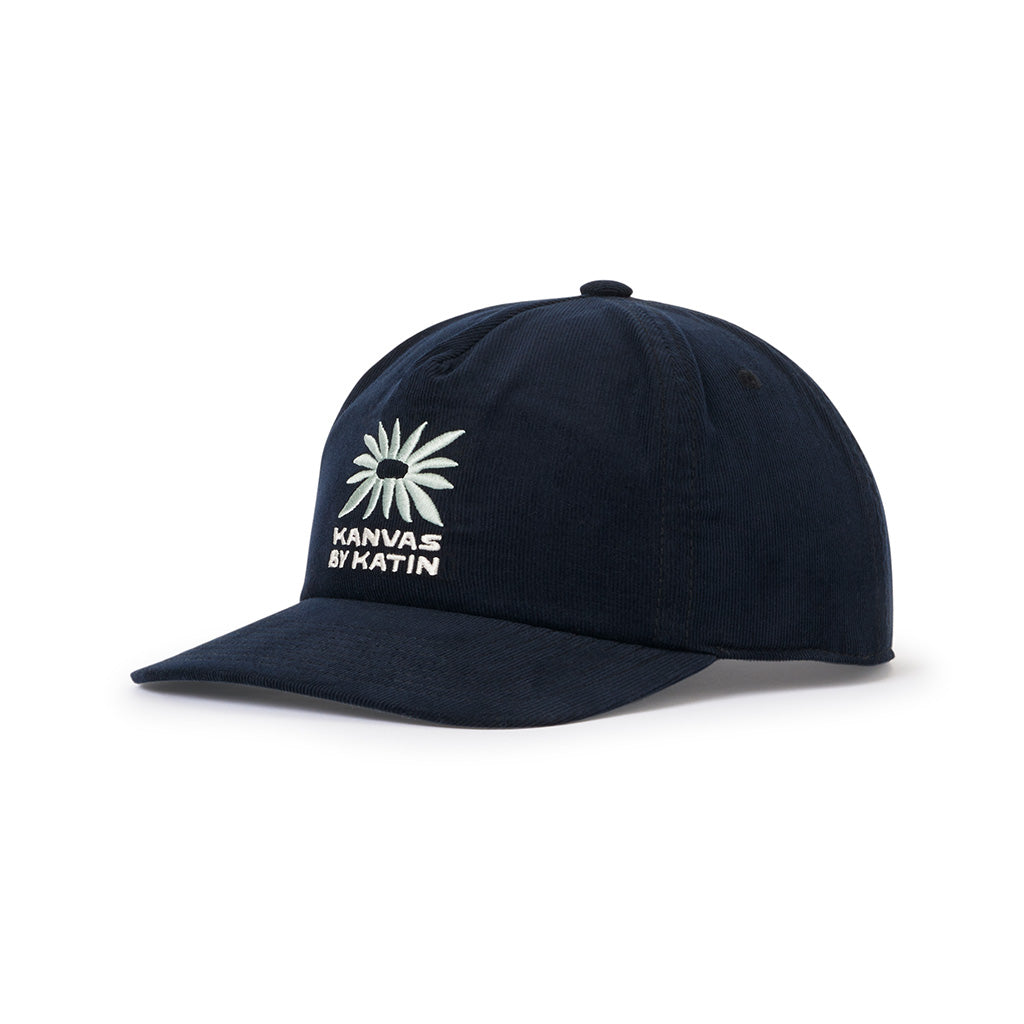 Katin Anemone Hat in polar navy corduroy with white embroidered flower and "KANVAS BY KATIN" text.