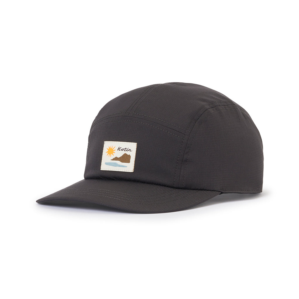 Black Katin OTG Sunstone Camp Hat with a colorful sun, mountain, and water patch.