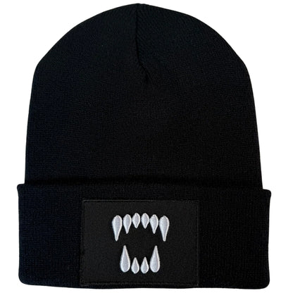Black cuffed knit beanie with embroidered Dawn Fang logo patch by Blak Bear Surf Club.
