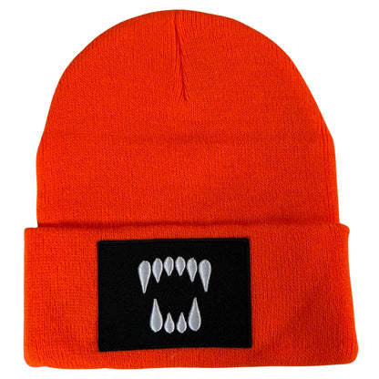 Orange cuffed knit beanie with embroidered Dawn Fang logo patch by Blak Bear Surf Club.