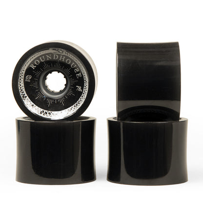 Four black Carver Roundhouse 69mm 78A concave surfskate wheels with white branding.